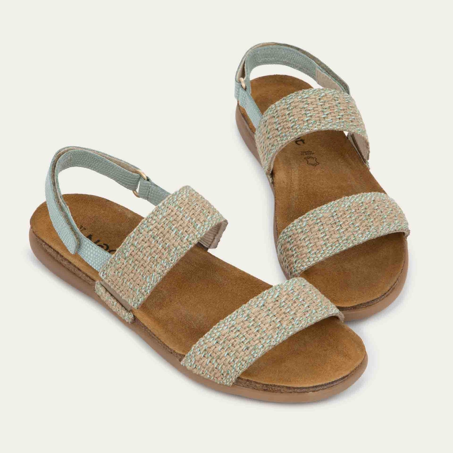 Pair of green sandals featuring two textured toe straps and an adjustable ankle strap on a cork footbed.
