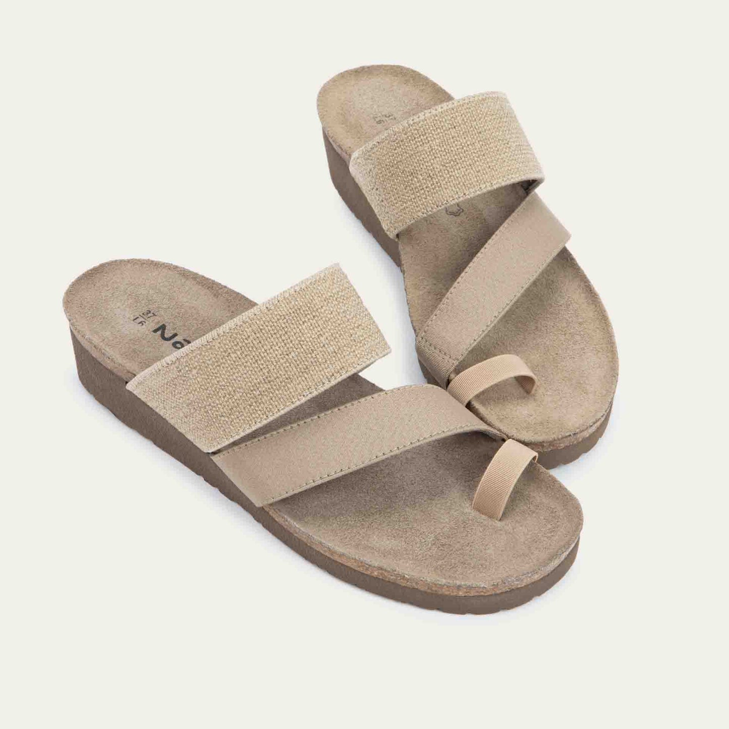 Pair of beige, multi-strap, sling-back sandals with a cork footbed.
