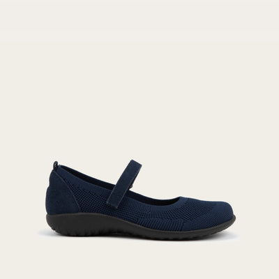 Profile view of a blue knit mary jane.