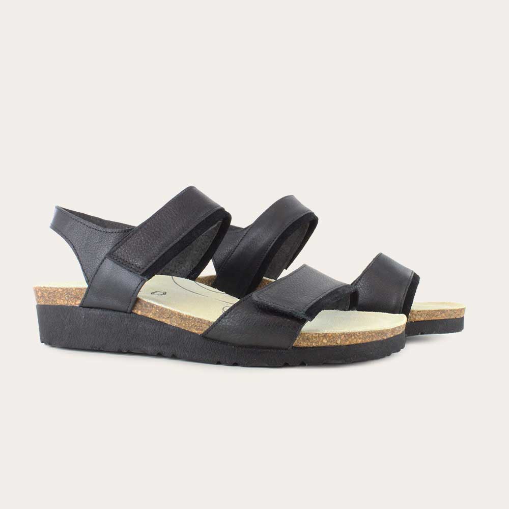 A pair of black leather sandals with two adjustable straps and a cork platform sole.