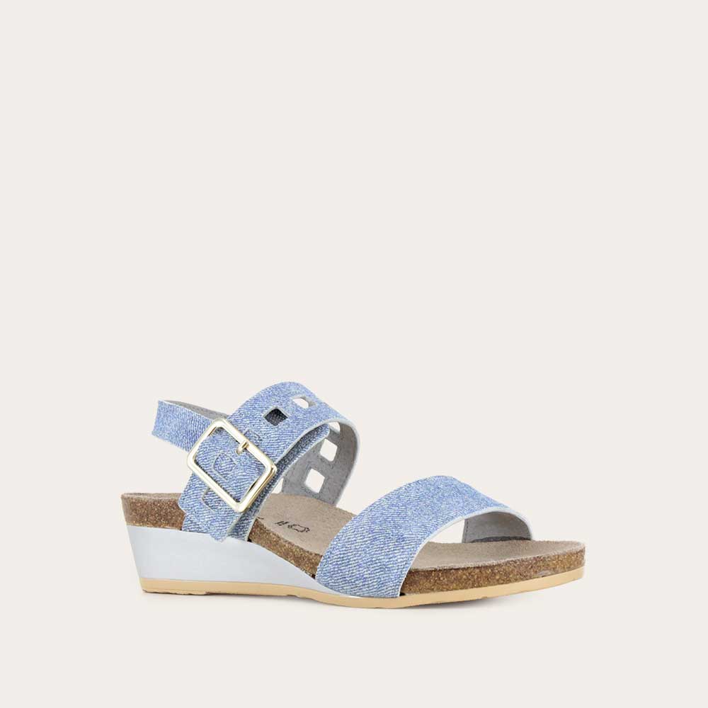 Angled profile view of a blue denim wedge sandal, featuring two straps and a metallic buckle with a cork footbed.