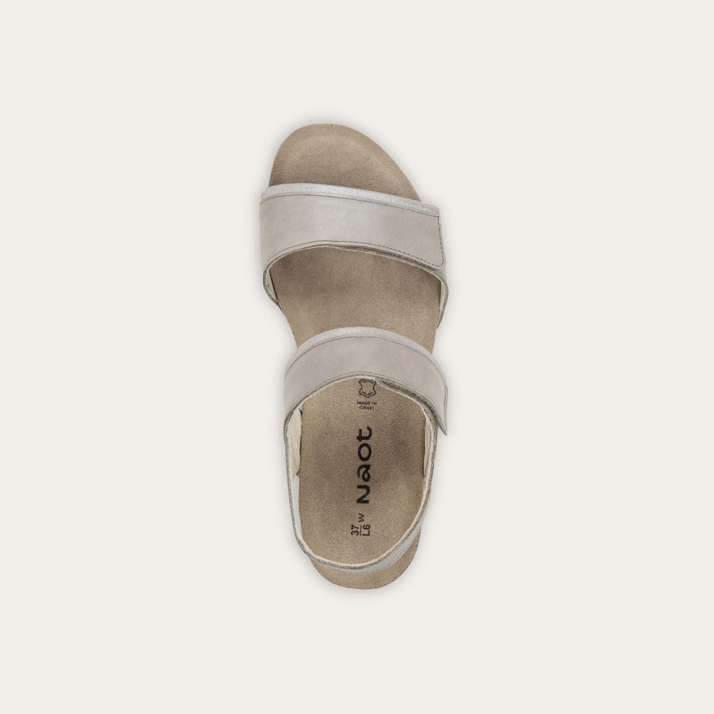 Top view of a silver leather sandal with two adjustable straps and a cork platform sole.