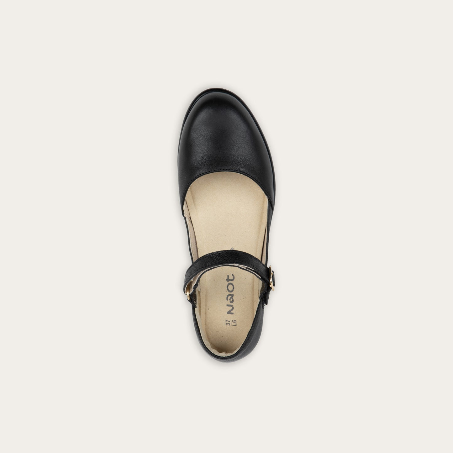 Top view of a black maryjane with a simple buckle strap on a black and brown sole