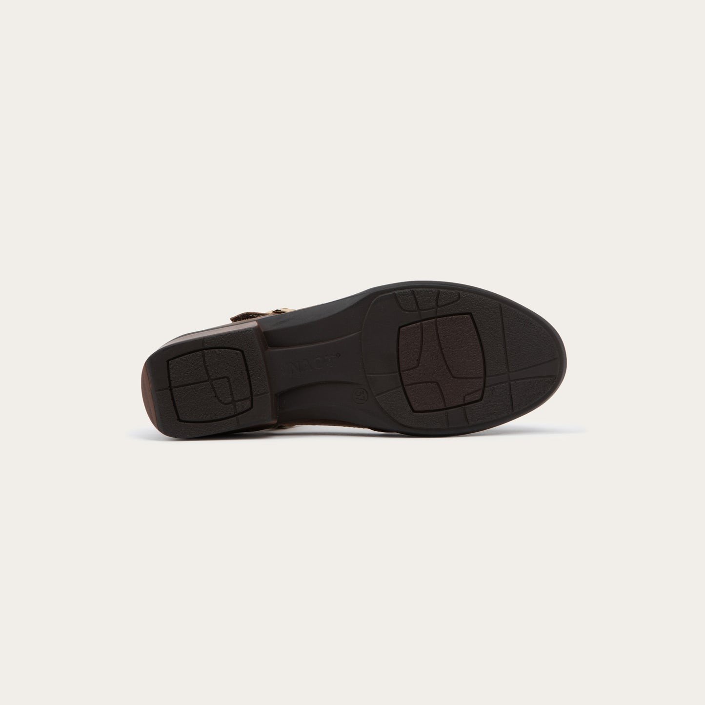 Bottom view of a brown maryjane with a simple buckle strap on a black and brown sole