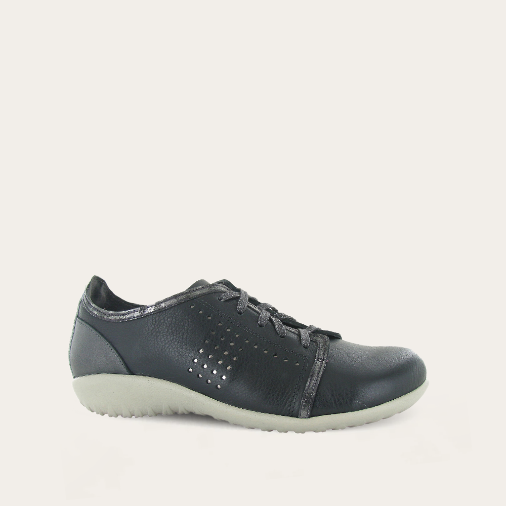 Black leather shoe on a light gray background