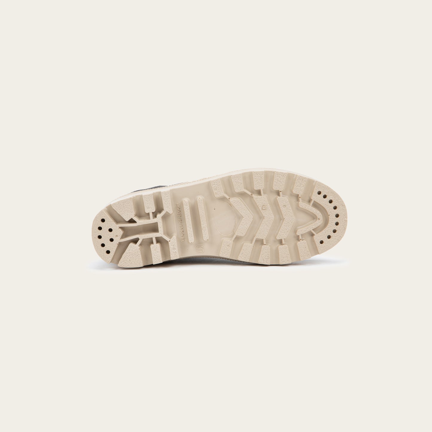 Bottom view of a black textured suede high-top boot with black laces and a light beige sole. 