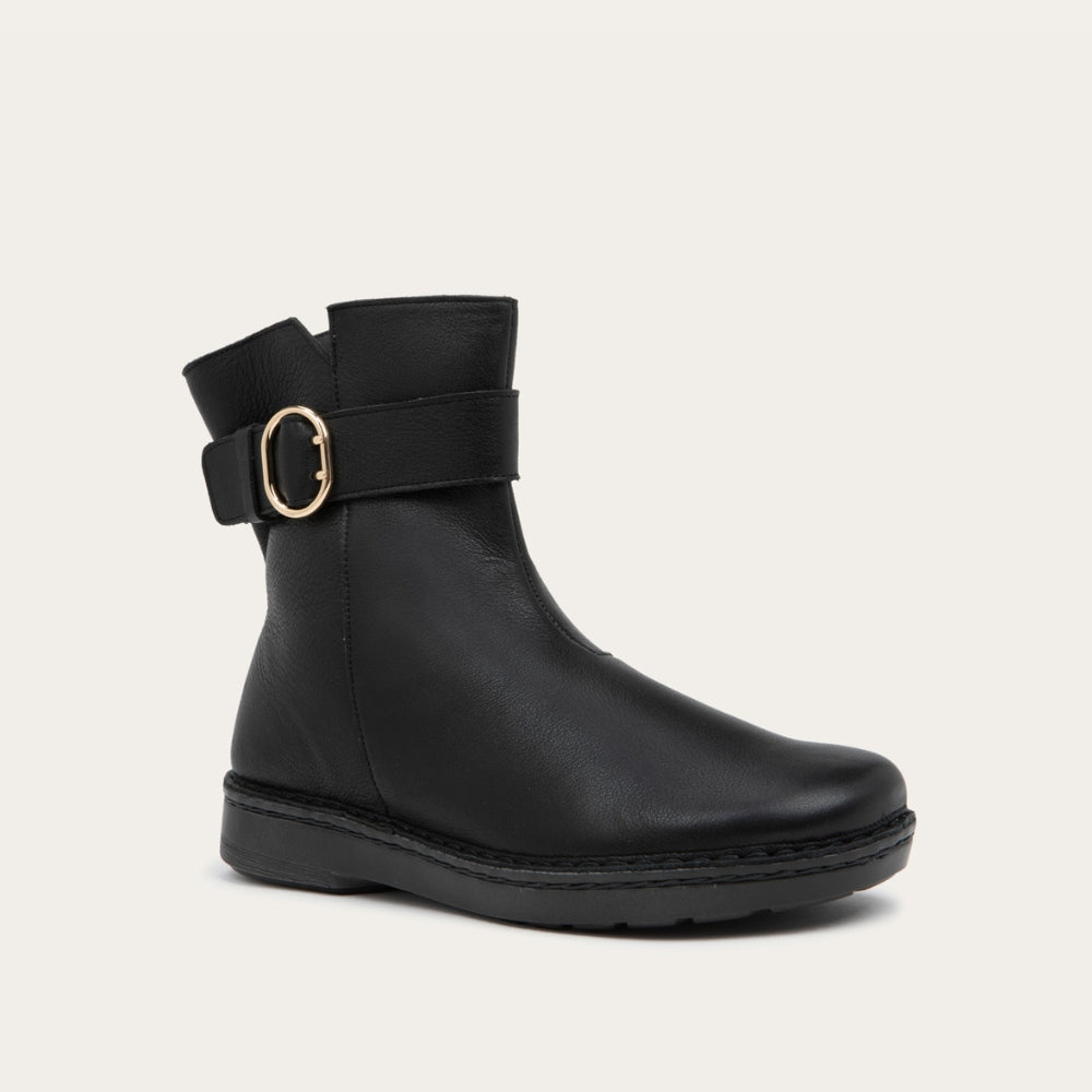 Angled view of a black calf boot with a simple strap and buckle detail