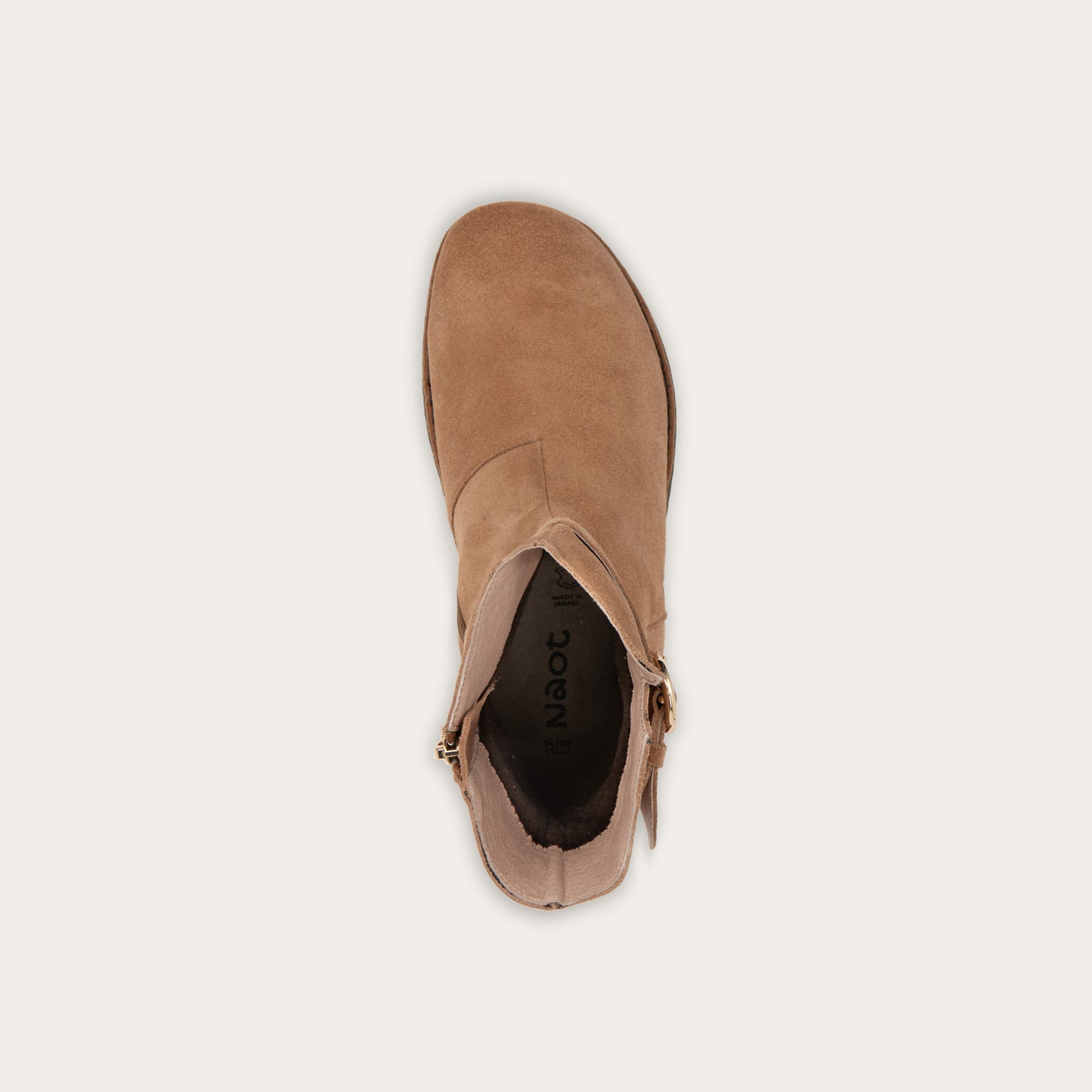 Top view of a tan calf boot with a simple strap and buckle detail
