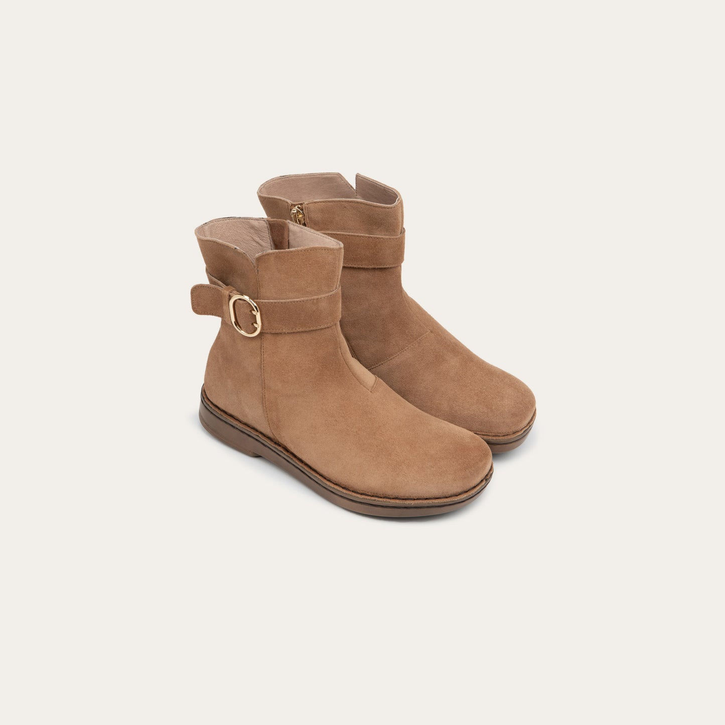 Pair of  tan calf boots with a simple strap and buckle detail