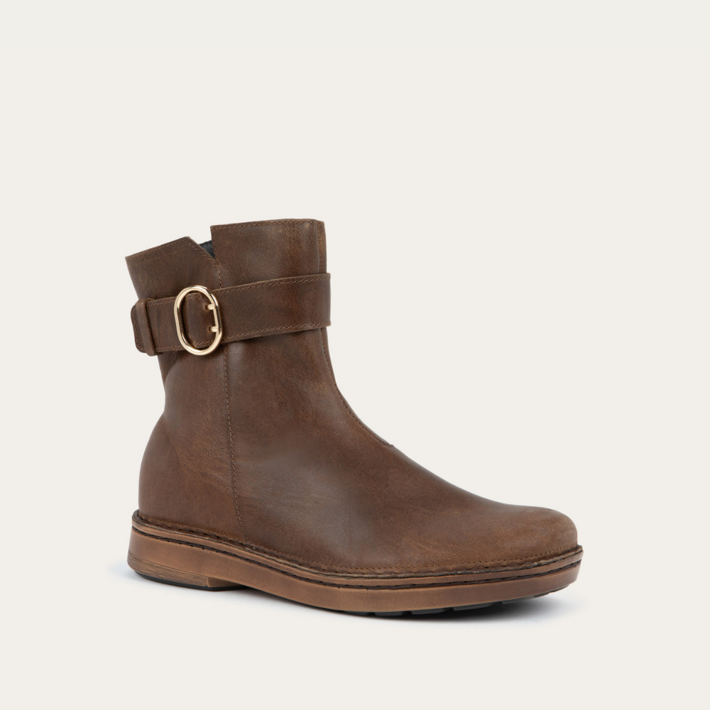 Angled view of a brown calf boot with a simple strap and buckle detail