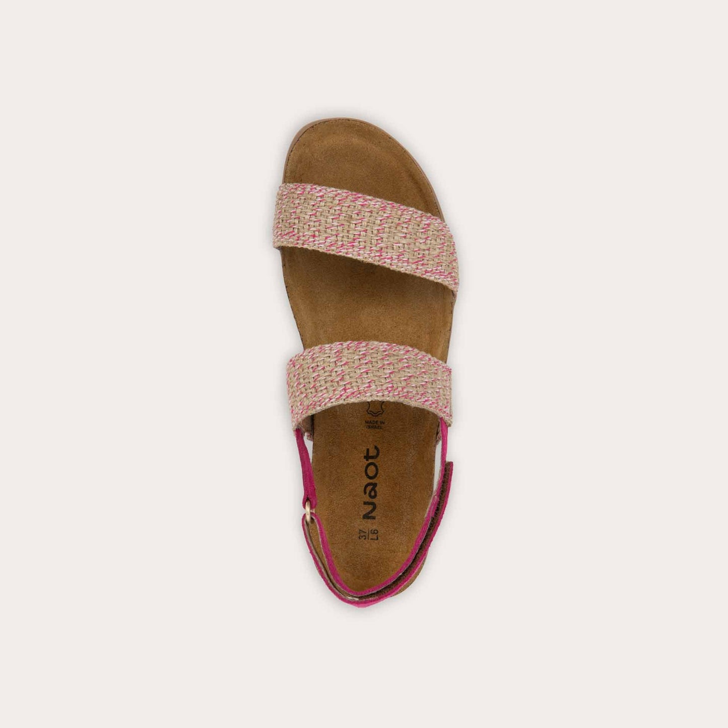 Top view of a pink sandal featuring two textured toe straps and an adjustable ankle strap on a cork footbed.