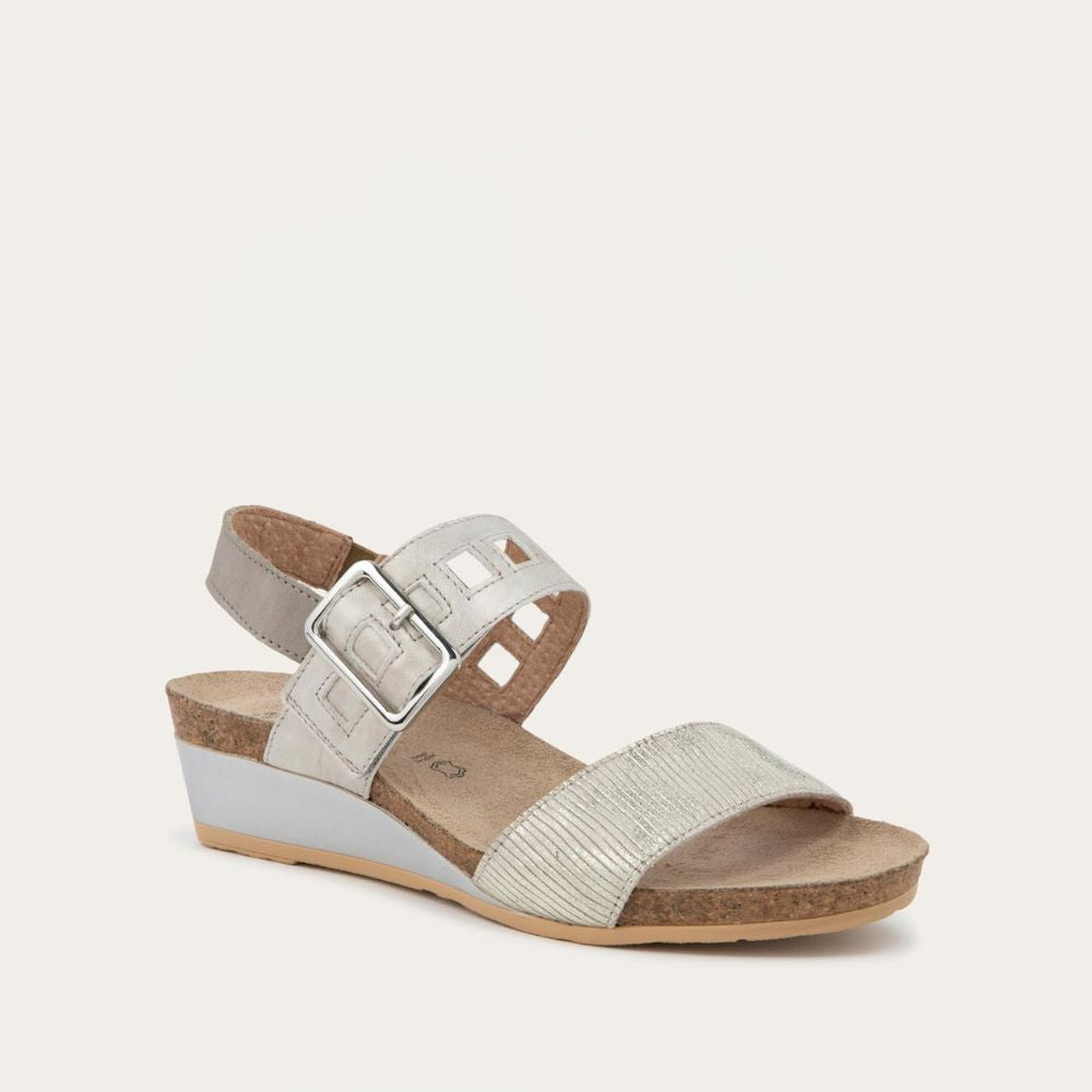 Angled profile view of a grey/beige metalic wedge sandal, featuring two straps and a metallic buckle with a cork footbed.