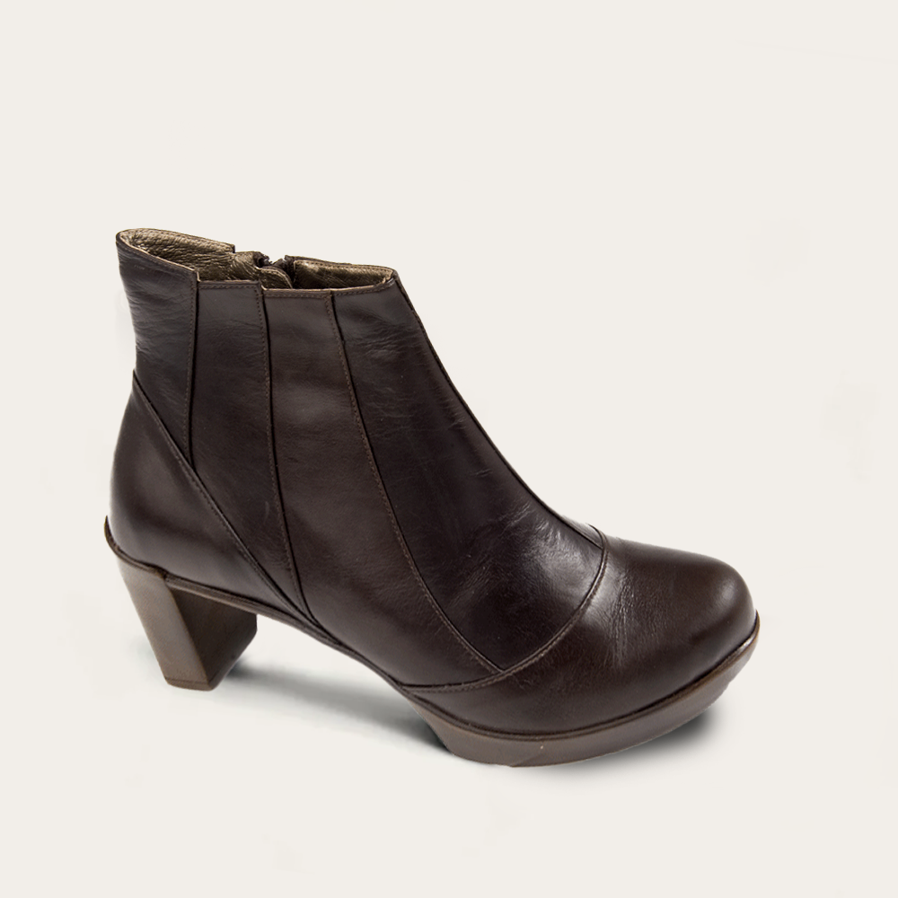 Brown leather ankle boot on a light gray background