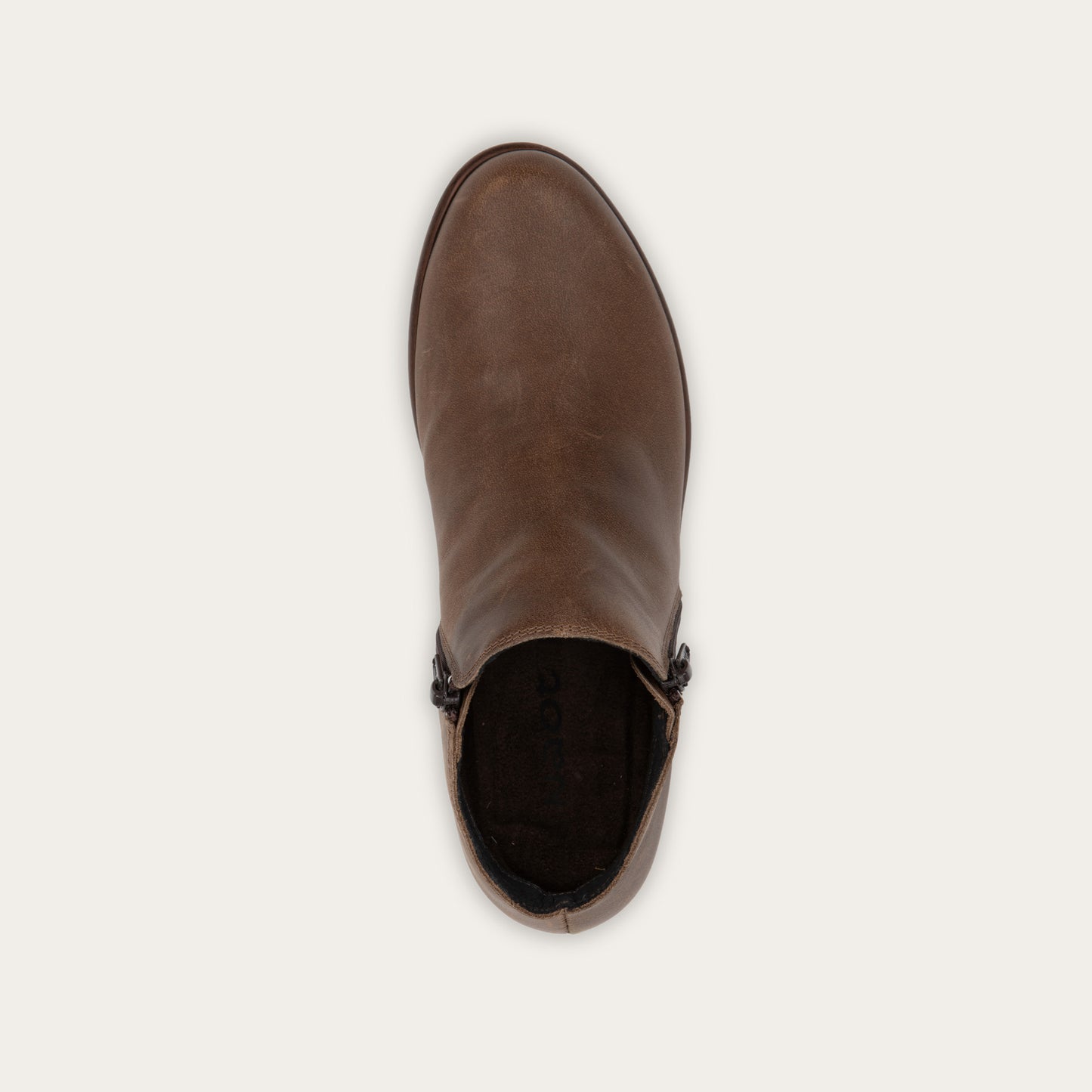 Top view of a brown bootie with a black and brown sole.