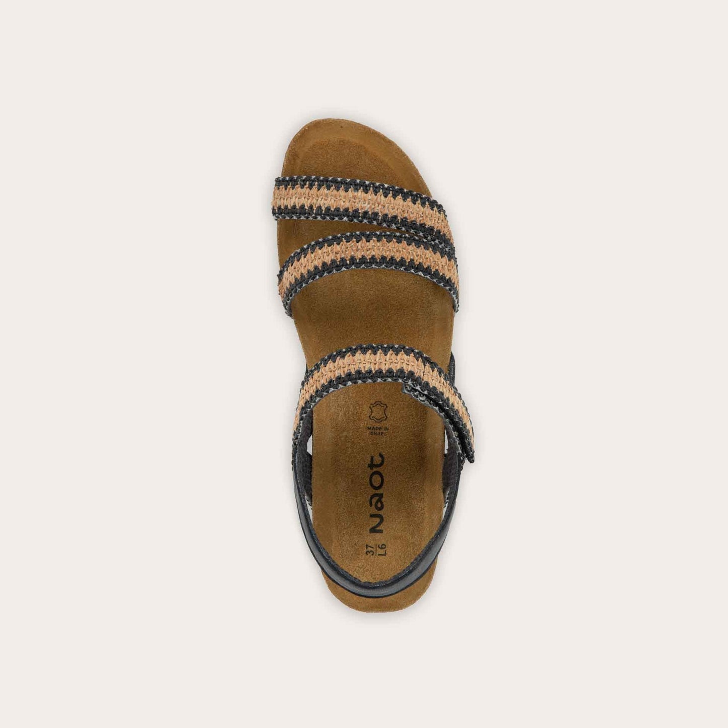 Top view of beige, multi-strap, sling-back sandal with a cork footbed.