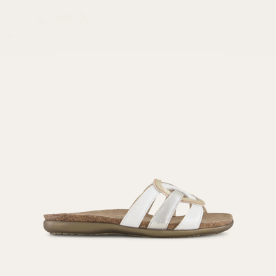 A beige and white Liv sandal by Naot, featuring multiple straps and a padded heel.
