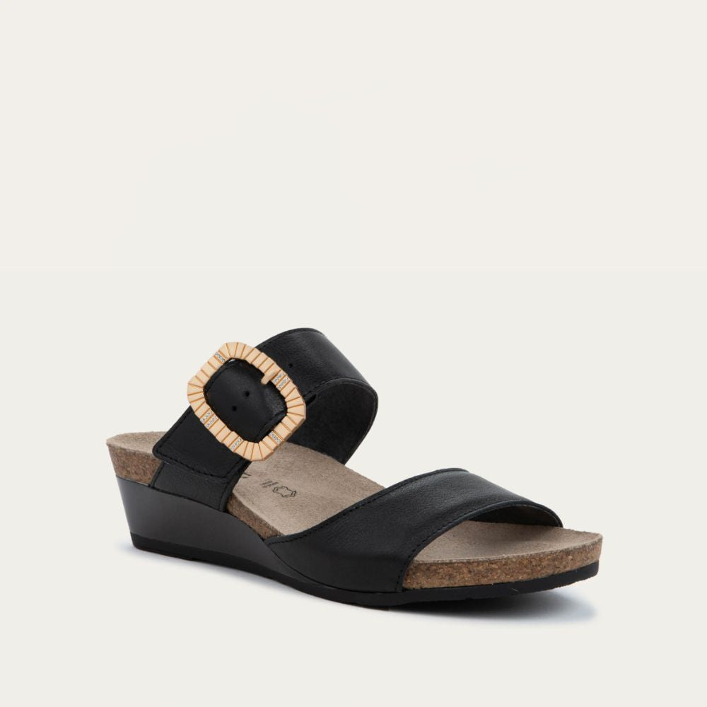 Angled profile view of a black slip-on wedge sandal with two straps and a large textured buckle. 