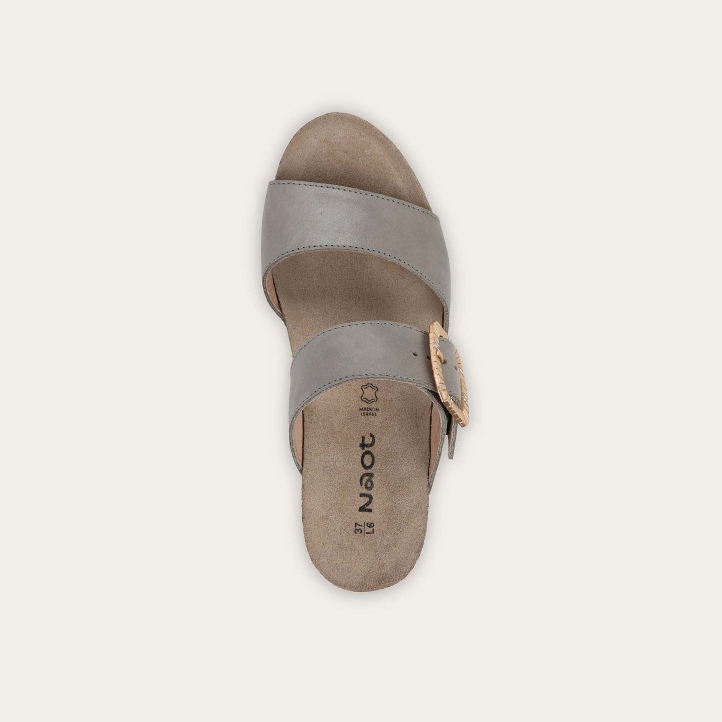 Top view of a black slip-on wedge sandal with two straps and a large textured buckle. 