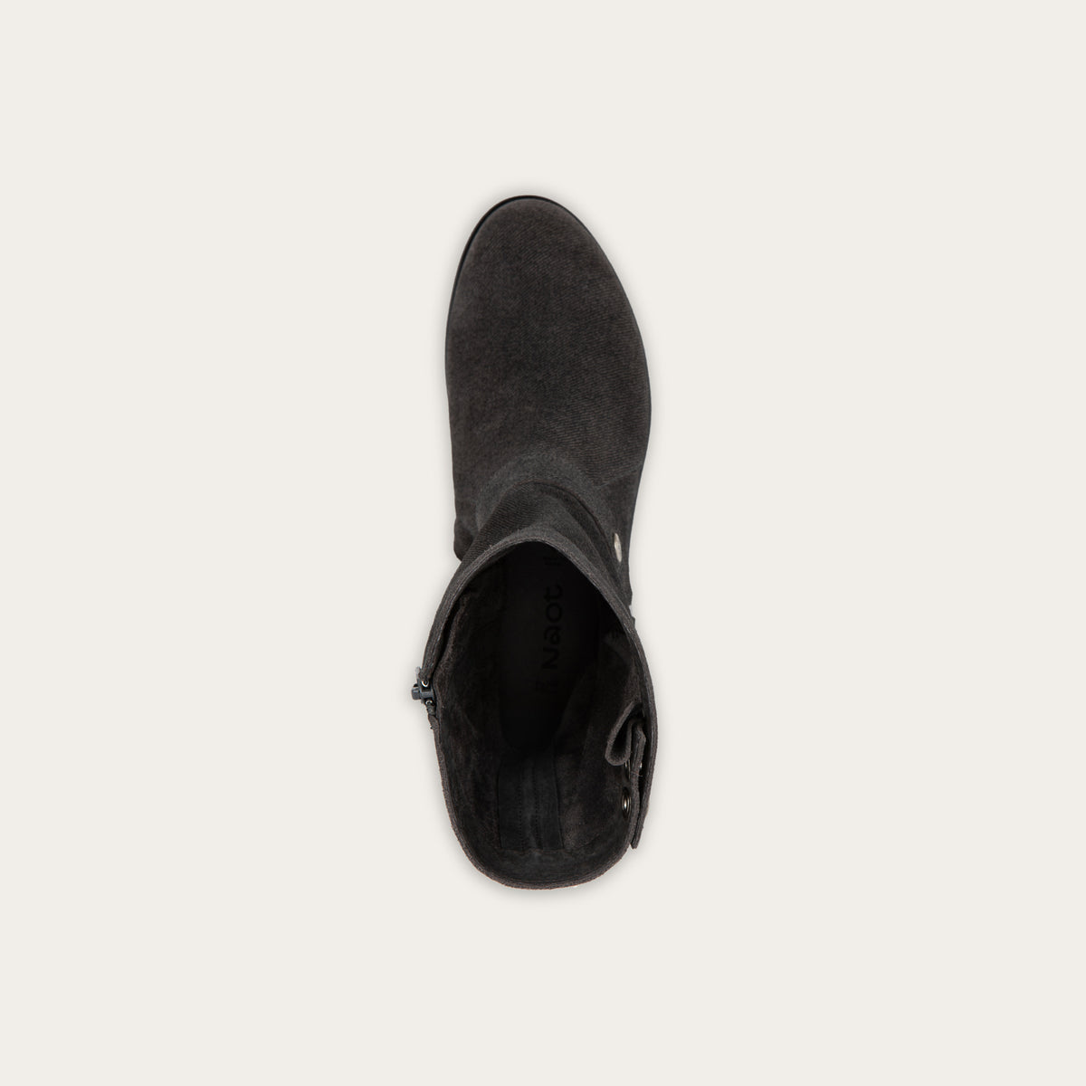 Top view of a black suede mid-calf boot with decorative t-strap and buckle, side zipper, rounded toe, and low stacked heel