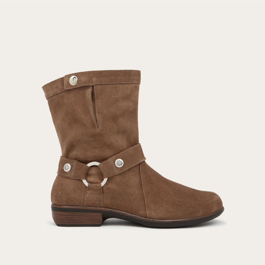 Profile view of a brown suede mid-calf boot with decorative t-strap and buckle, side zipper, rounded toe, and low stacked heel