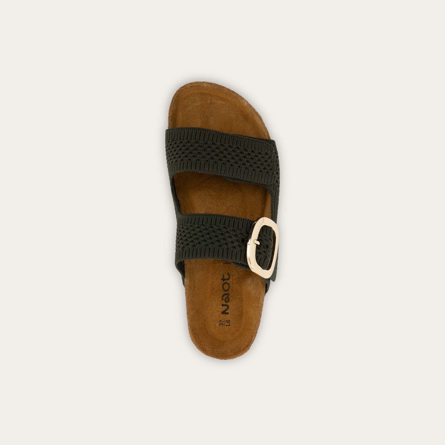 Top view of a blue slip-on sandal with two adjustable knit straps and a large gold buckle. It has a cork footbed and a black sole.