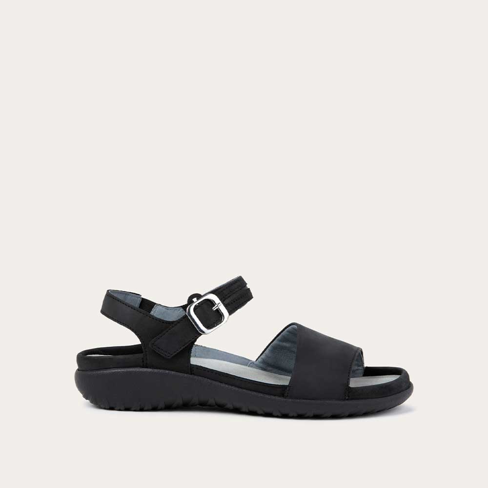 Profile view of a black, open toe sandal, featuring a toe strap and asjustable ankle strap with a silver accent buckle.