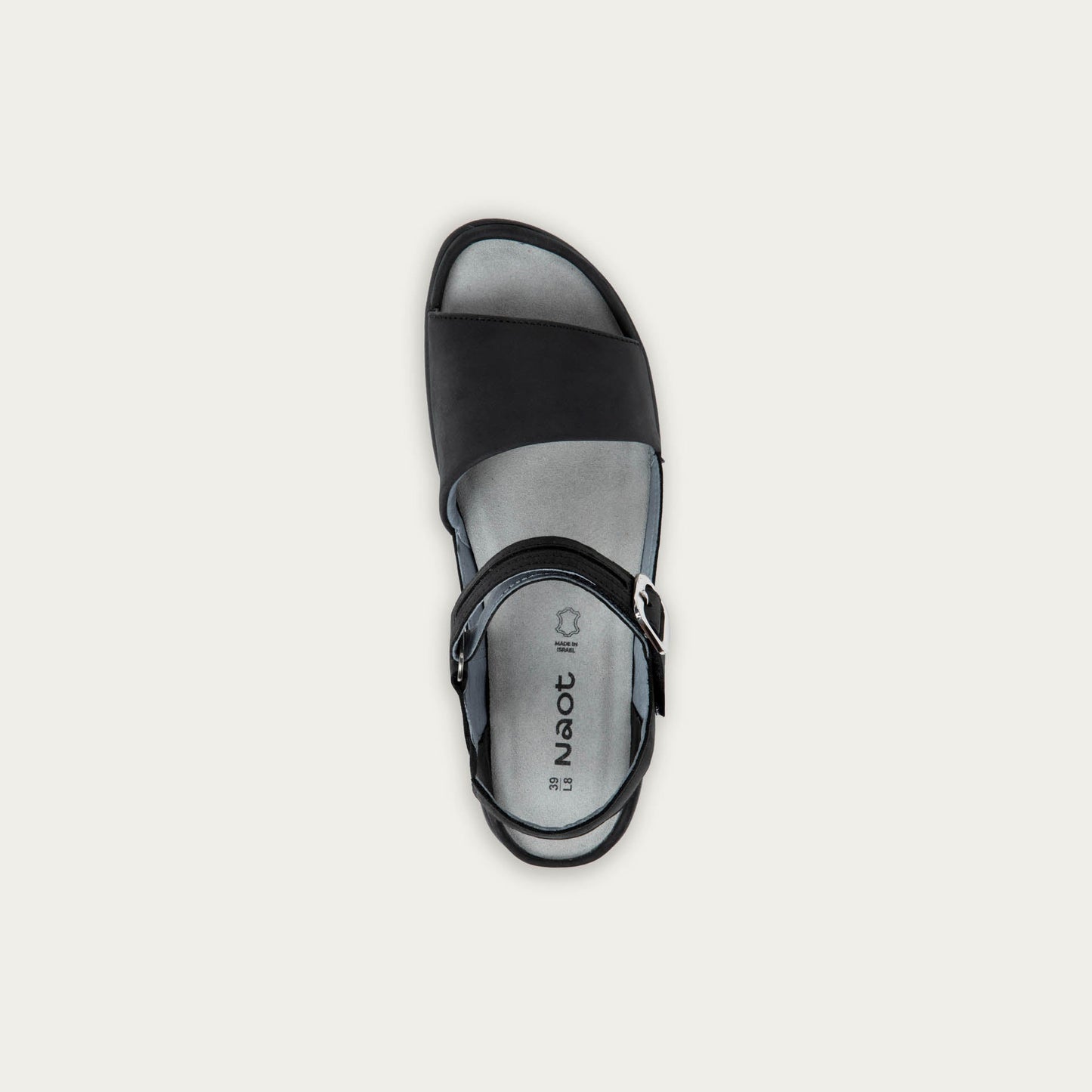 Top view of a black, open toe sandal, featuring a toe strap and asjustable ankle strap with a silver accent buckle.