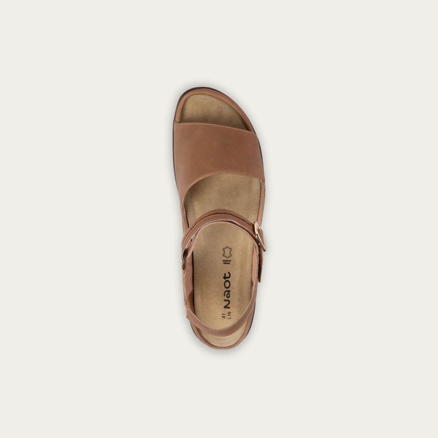 Top view of a brown, open toe sandal, featuring a toe strap and asjustable ankle strap with a silver accent buckle.