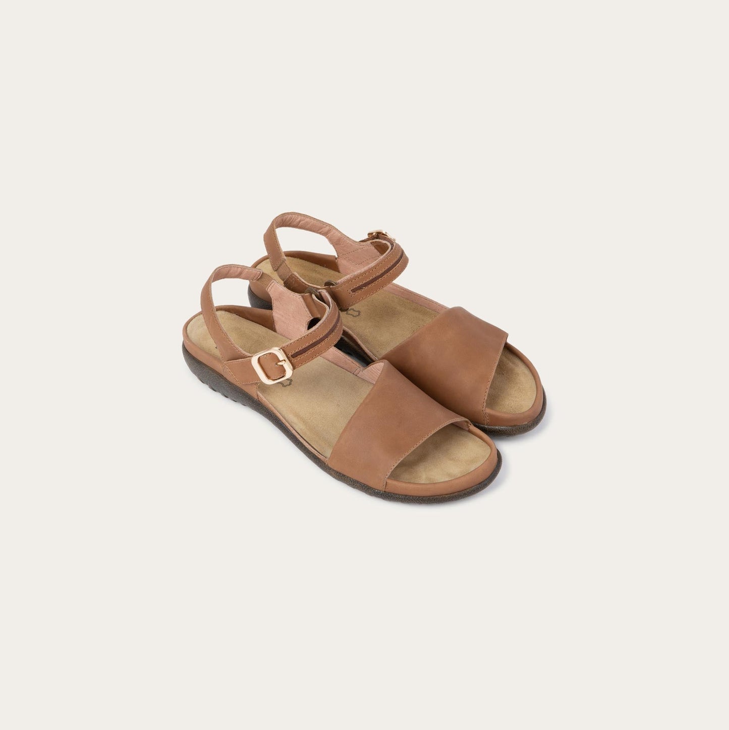 Pair of  brown, open toe sandals, featuring a toe strap and asjustable ankle strap with a silver accent buckle.