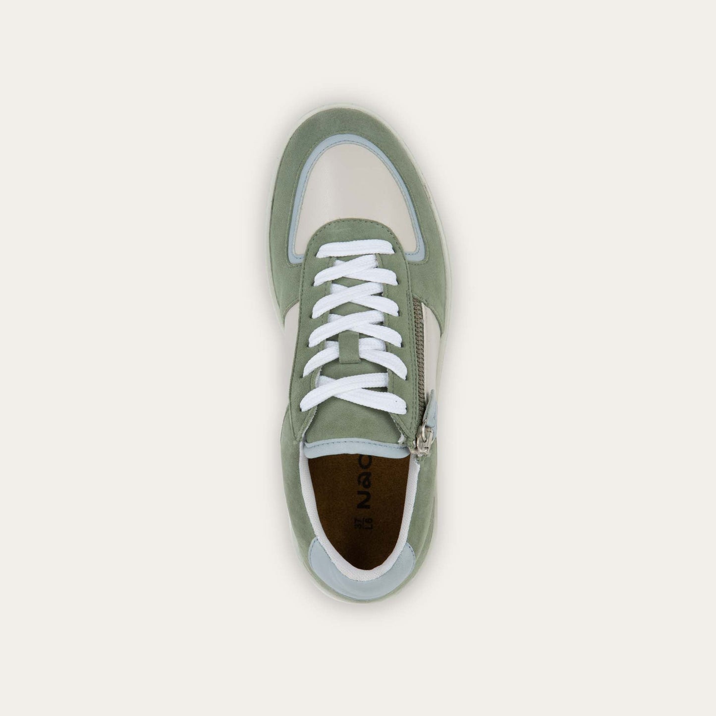 Top view of a multicolored green and white sneaker with laces and a side zipper.