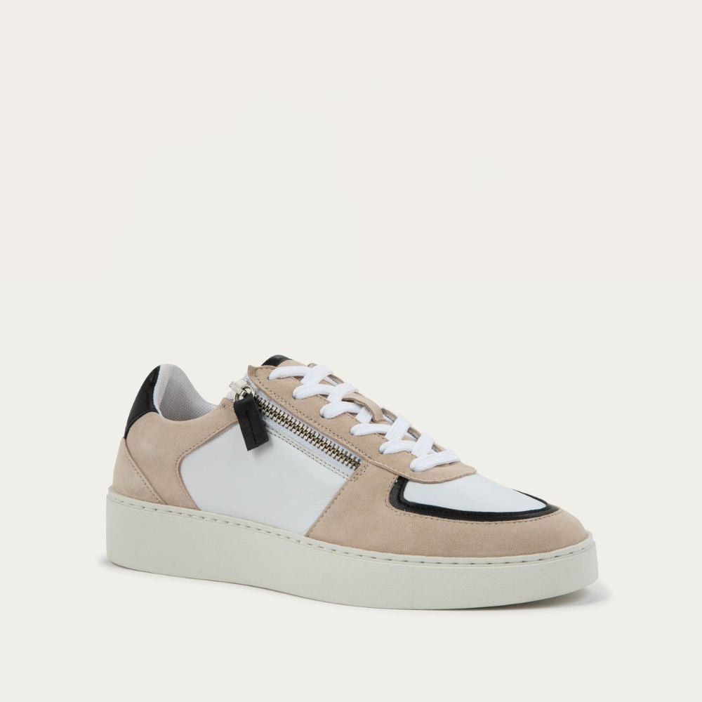 Angled profile view of a multicolored white, beige, and black sneaker with laces and a side zipper.