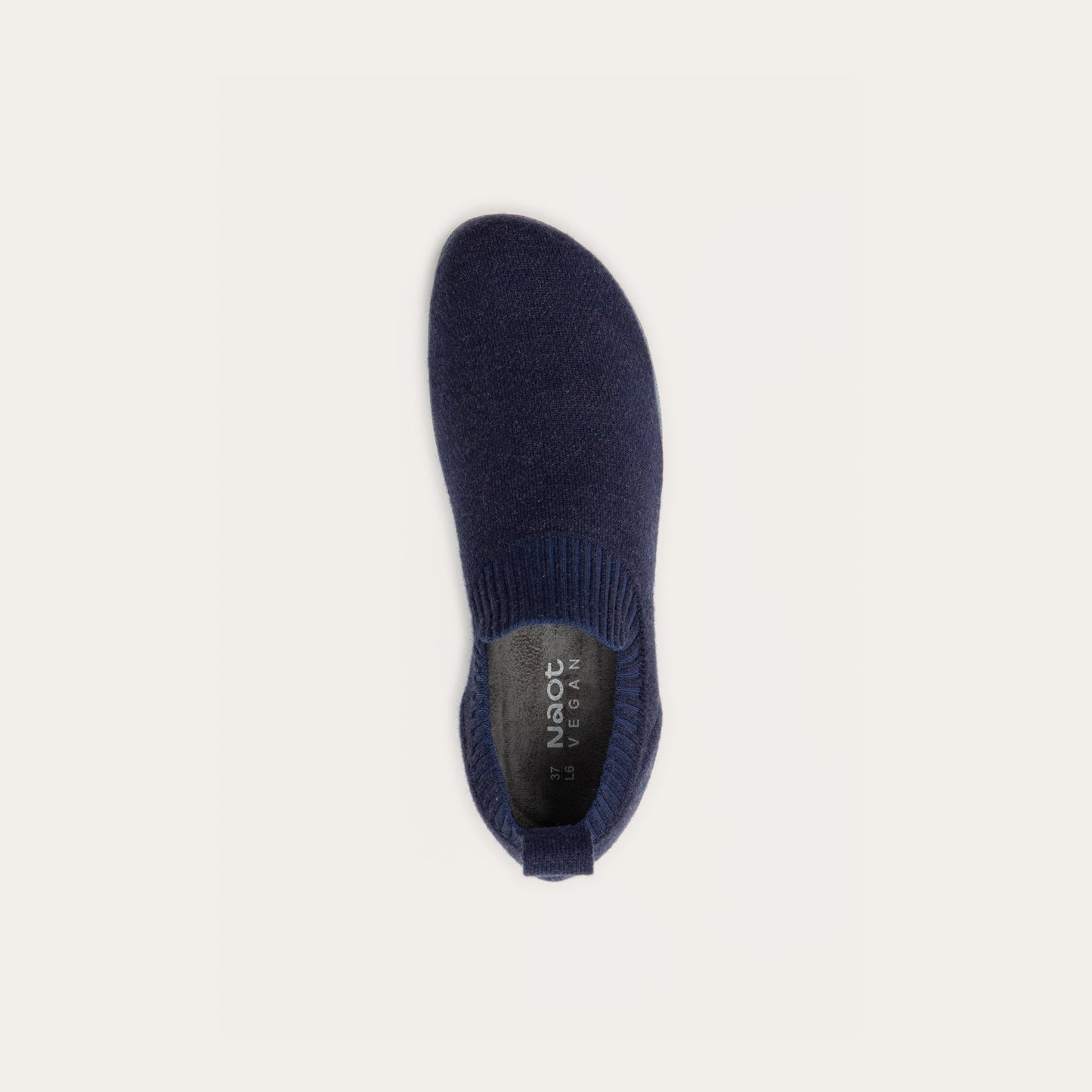 Top view of a navy knit slip-on vegan shoe