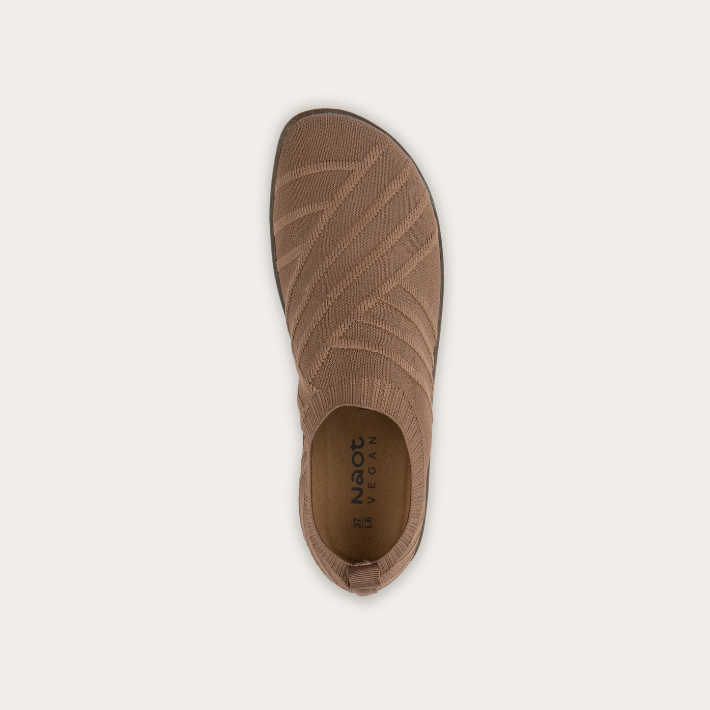 Top view of brown knit slip-on shoe on a gray sole