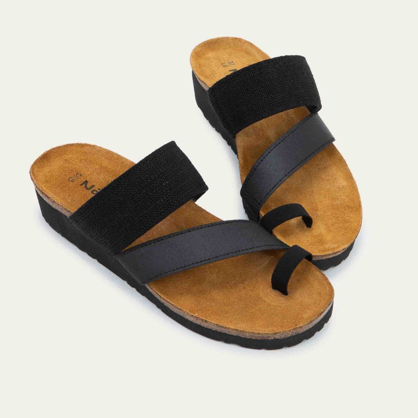 Pair of black, multi-strap slided with a toe loop and a cork footbed.