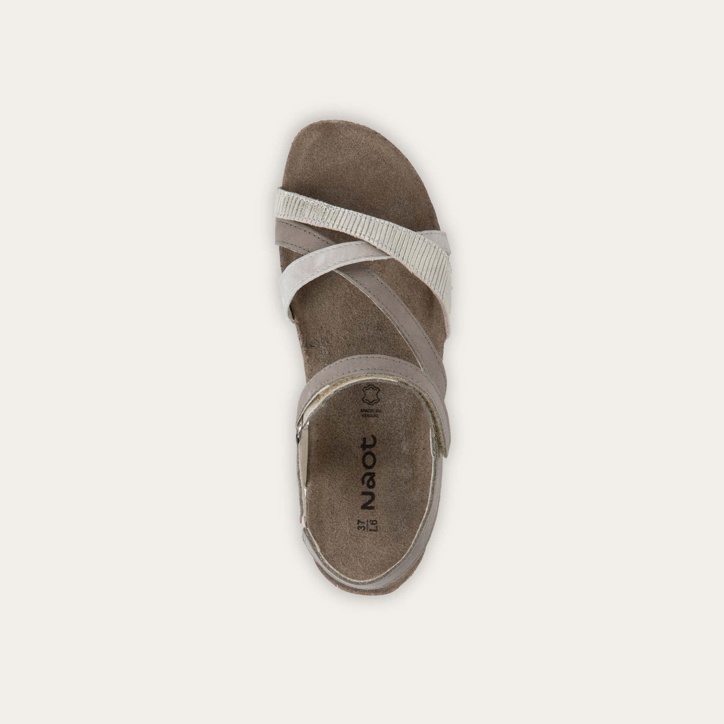 Top view of a gray open-toe sandal with a cork wedge sole. Features leather and suede straps crossing over the front and a back strap with Velcro closure. 