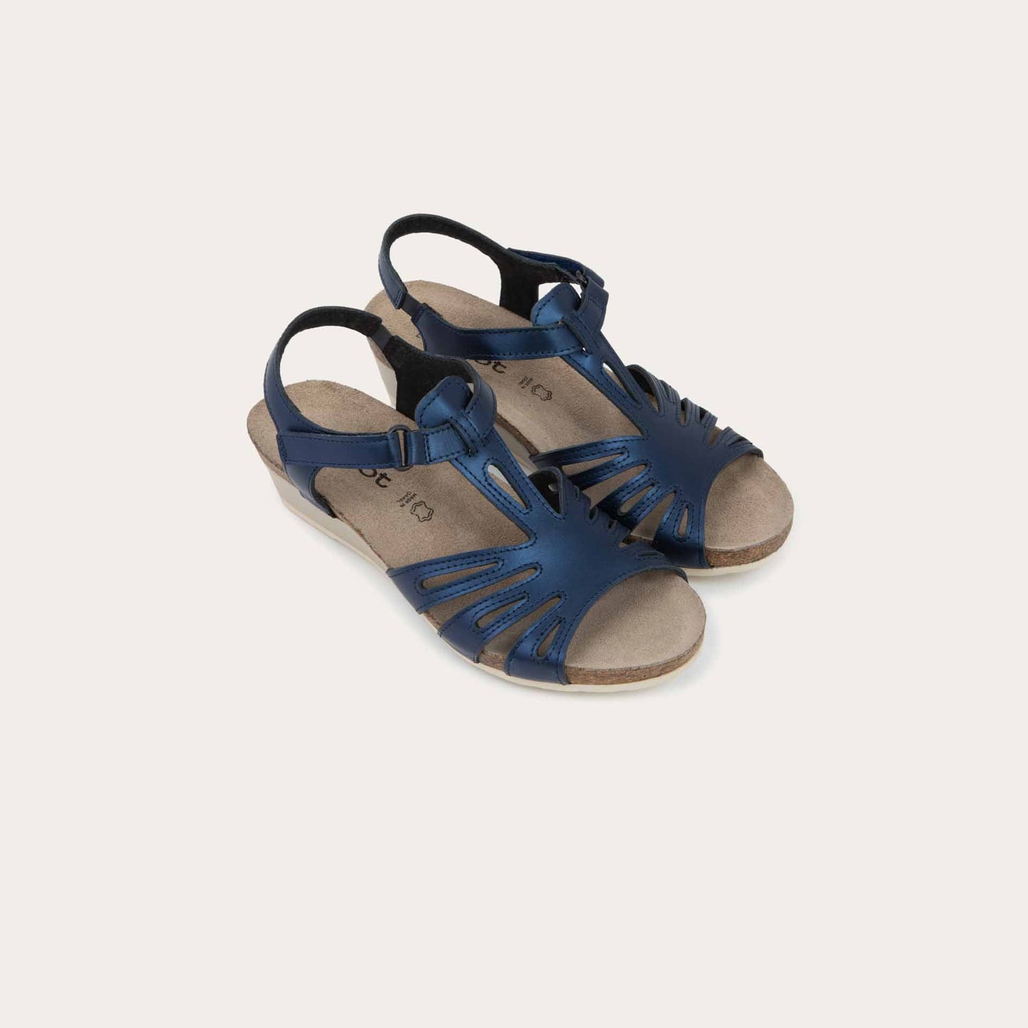 A pair of black wedge sandals with strappy design, open toe, and adjustable ankle strap on a cork footbed.