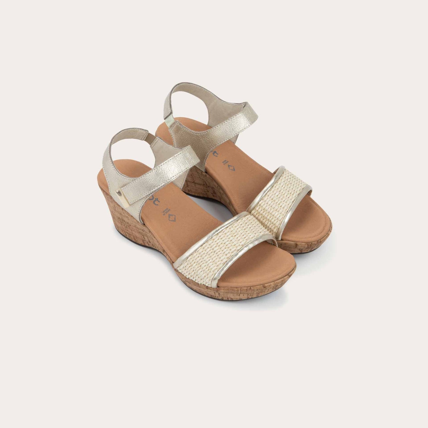 Pair of wedge heeled sandals with a gold leather ankle strap, and woven beige front strap