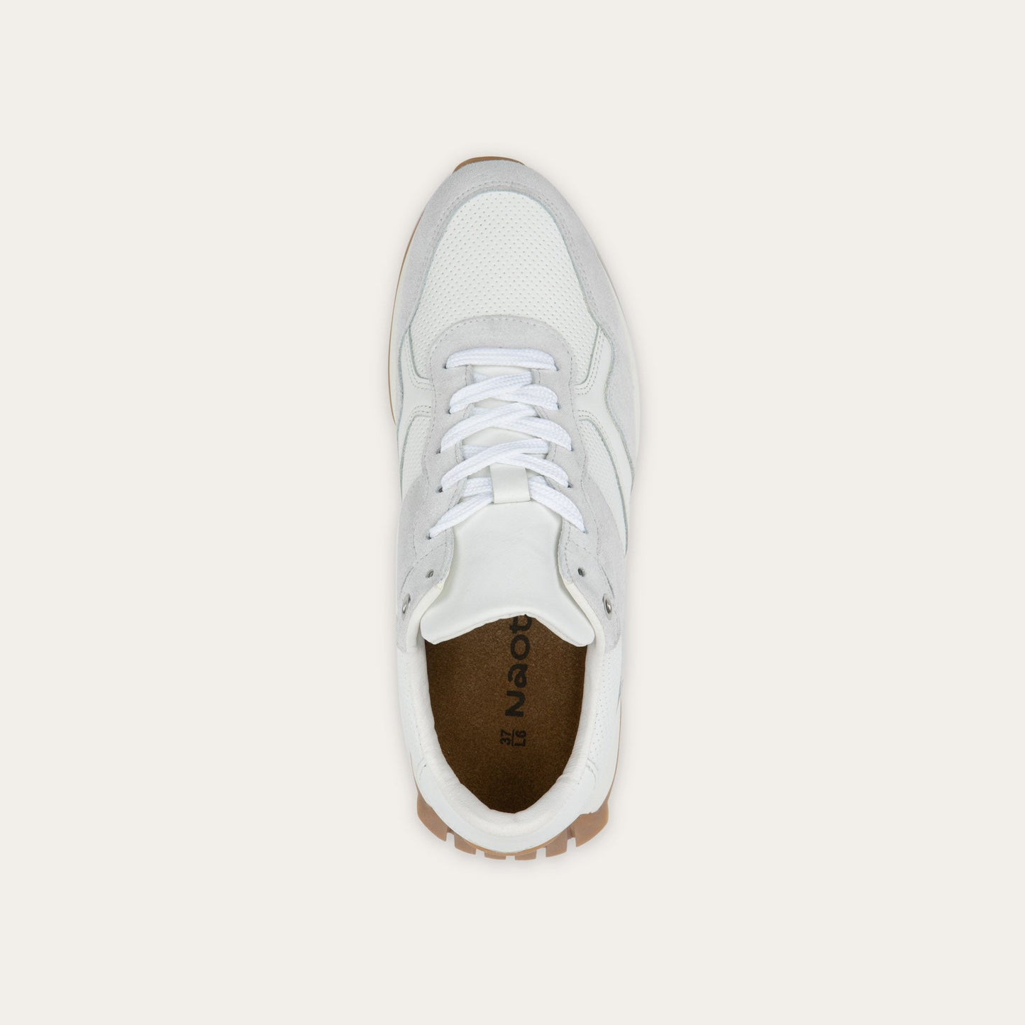 Top view of a multi-material white lace up sneaker.