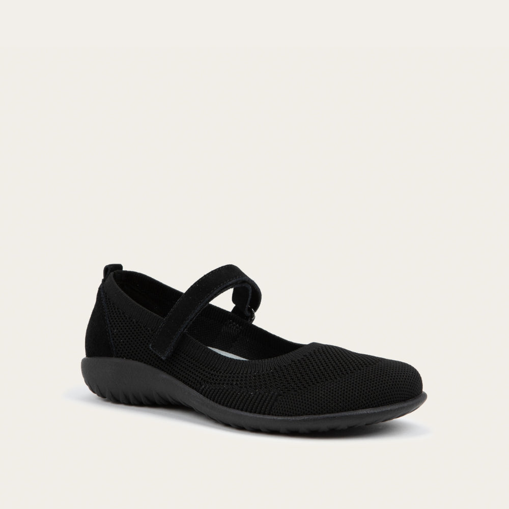 Angled profile view of a  black knit mary jane.