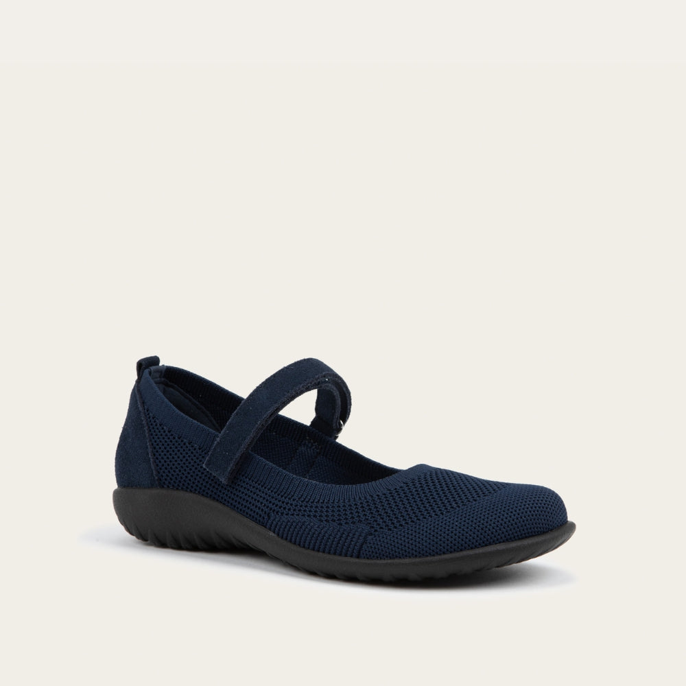 Angled profile view of a  blue knit mary jane.
