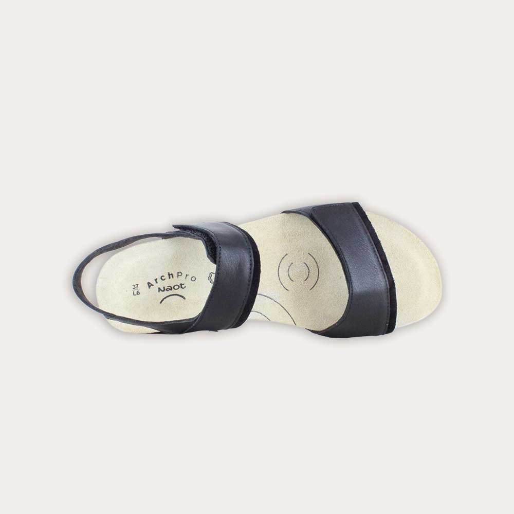 Top view of a black leather sandal with two adjustable straps and a cork platform sole.