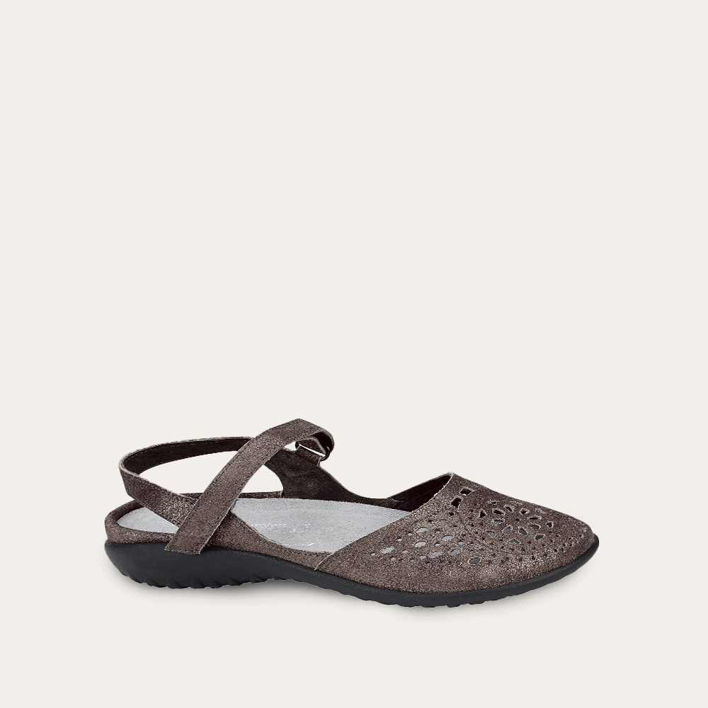 Brown sandal with a strap on a light beige background